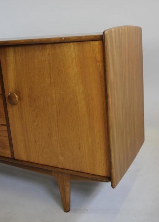 A TEAK LOW SIDEBOARD by A. Younger Ltd. Image