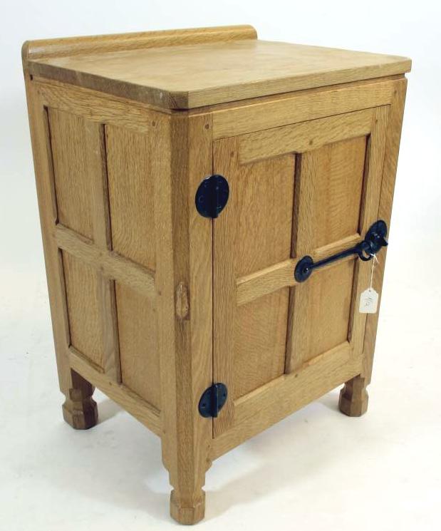 A ROBERT THOMPSON ADZED OAK BEDSIDE CABINET Image