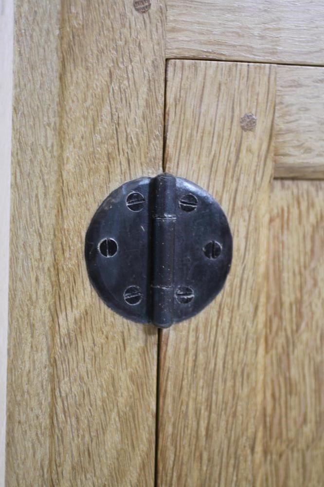 A ROBERT THOMPSON ADZED OAK BEDSIDE CABINET Image