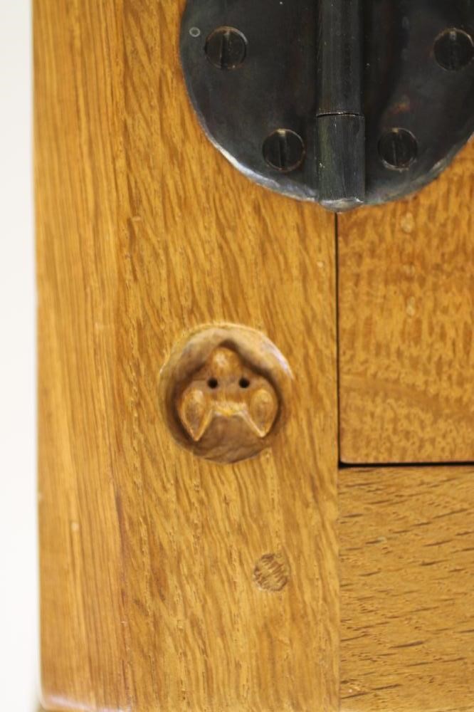 A MALCOLM PIPES ADZED OAK AND BURR OAK SIDE CABINET of canted multi panelled form Image