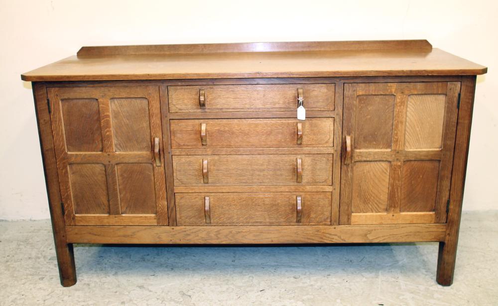AN OAK SIDEBOARD in the manner of Robert Thompson Image