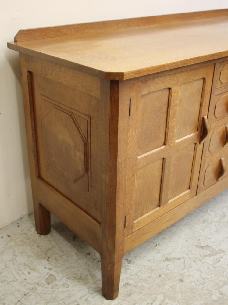 AN OAK SIDEBOARD in the manner of Robert Thompson Image