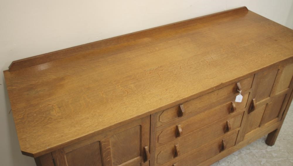 AN OAK SIDEBOARD in the manner of Robert Thompson Image
