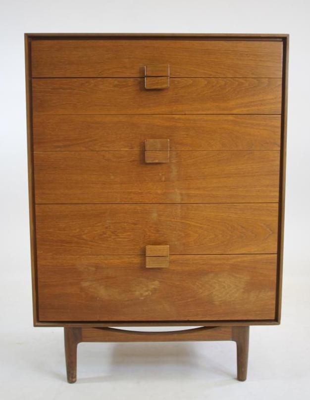 A KOFAD LARSEN G-PLAN TEAK CHEST of six graduated drawers with protruding oblong wooden handles Image