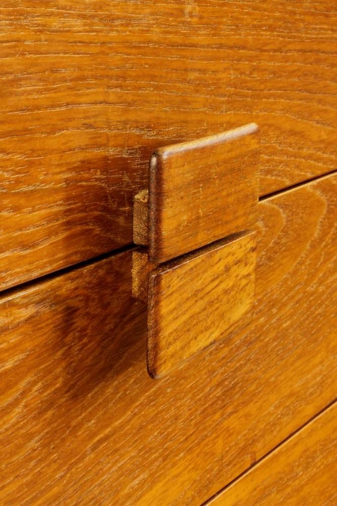 A KOFAD LARSEN G-PLAN TEAK CHEST of six graduated drawers with protruding oblong wooden handles Image