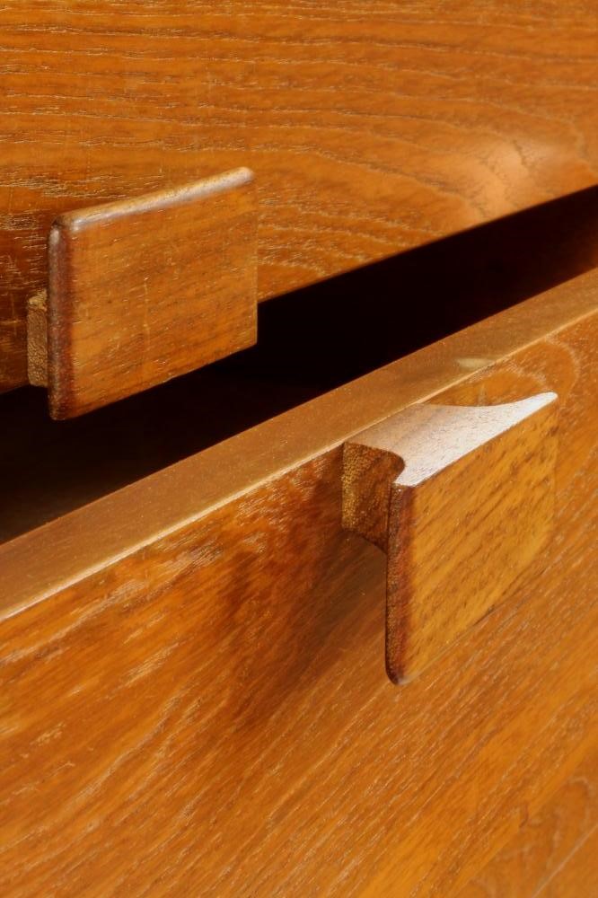 A KOFAD LARSEN G-PLAN TEAK CHEST of six graduated drawers with protruding oblong wooden handles Image