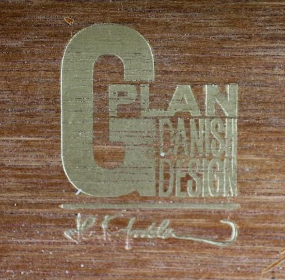 A KOFAD LARSEN G-PLAN TEAK CHEST of six graduated drawers with protruding oblong wooden handles Image