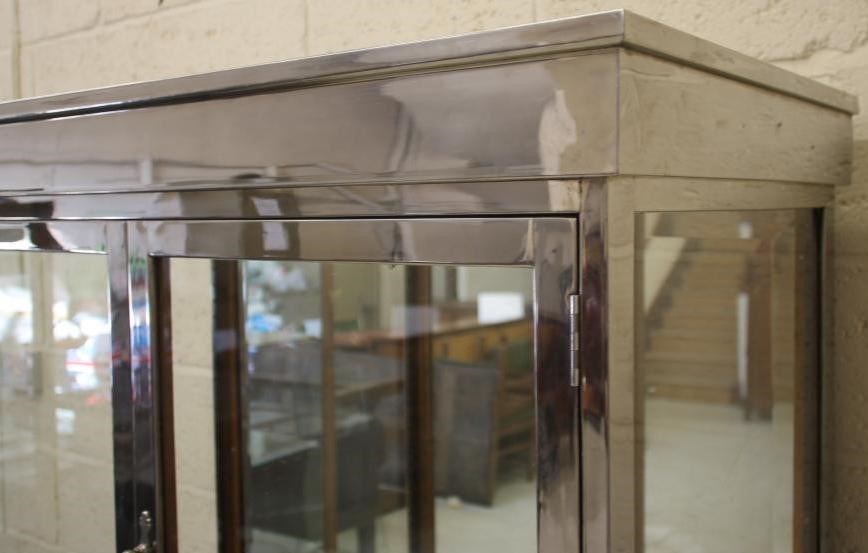 AN ART DECO OAK DISPLAY CABINET of oblong form with two doors having ring handles Image