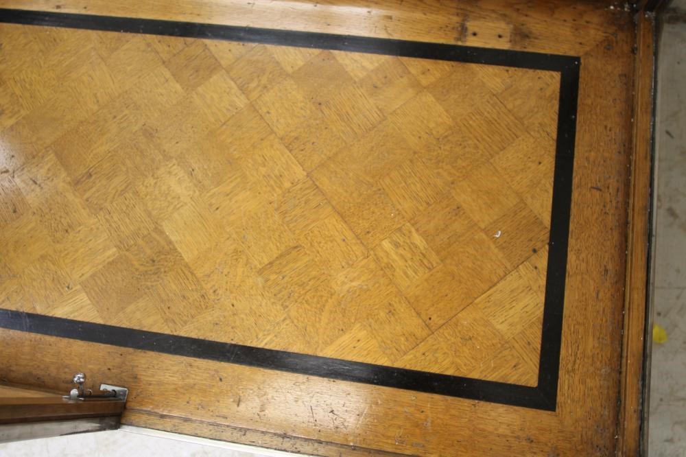 AN ART DECO OAK DISPLAY CABINET of oblong form with two doors having ring handles Image