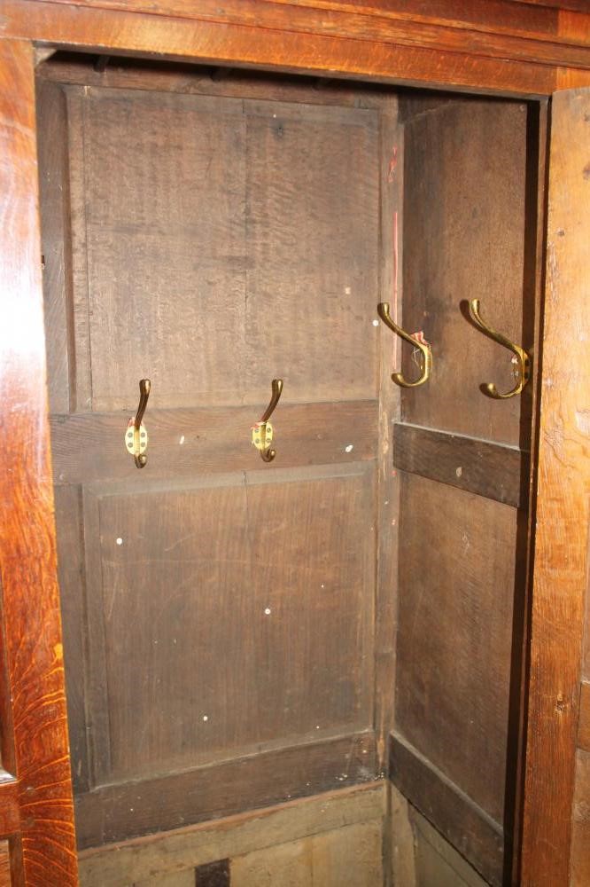 A GEORGE III OAK LIVERY CUPBOARD Image