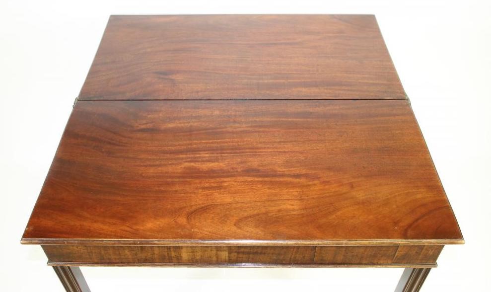 A GEORGIAN MAHOGANY FOLDING TEA TABLE Image