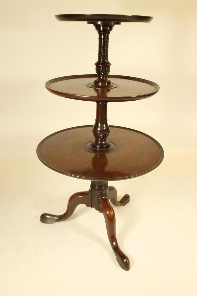 A GEORGE III MAHOGANY DUMB WAITER of three tier form with reeded edged trays Image