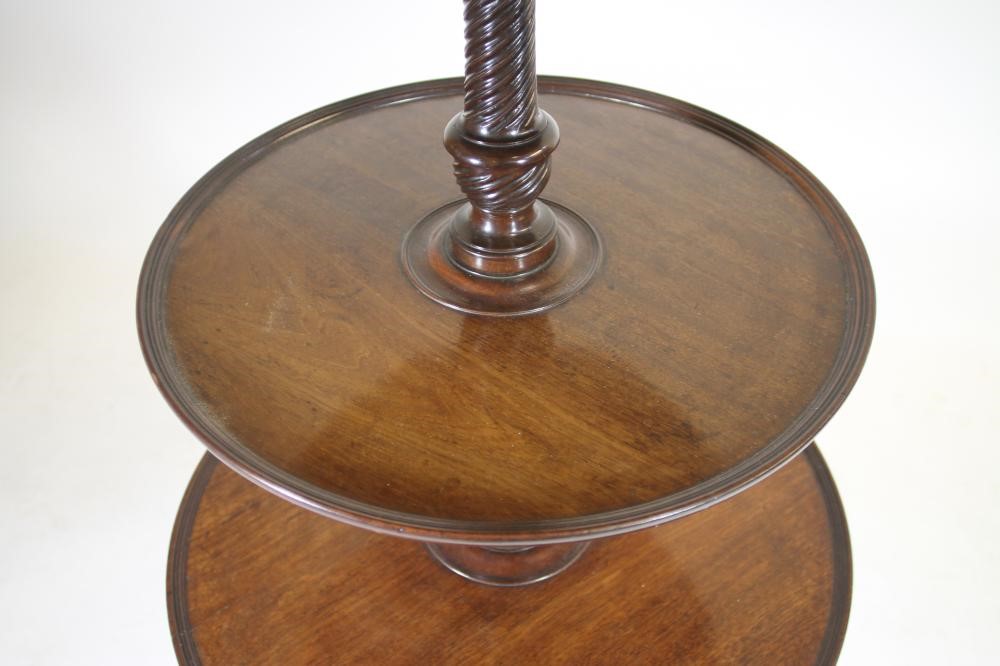 A GEORGE III MAHOGANY DUMB WAITER of three tier form with reeded edged trays Image