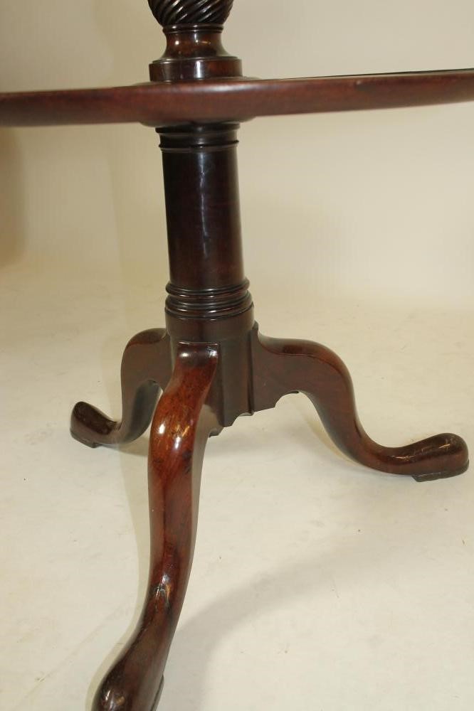 A GEORGE III MAHOGANY DUMB WAITER of three tier form with reeded edged trays Image