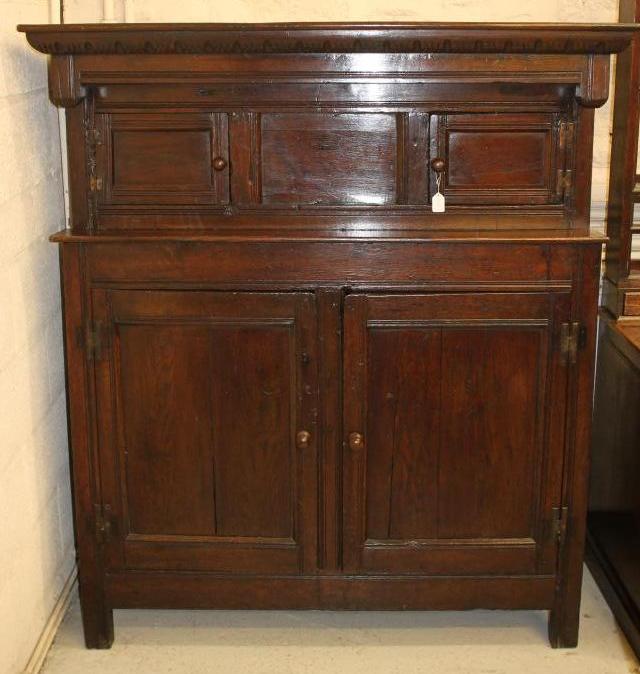 AN OAK PRESS CUPBOARD Image