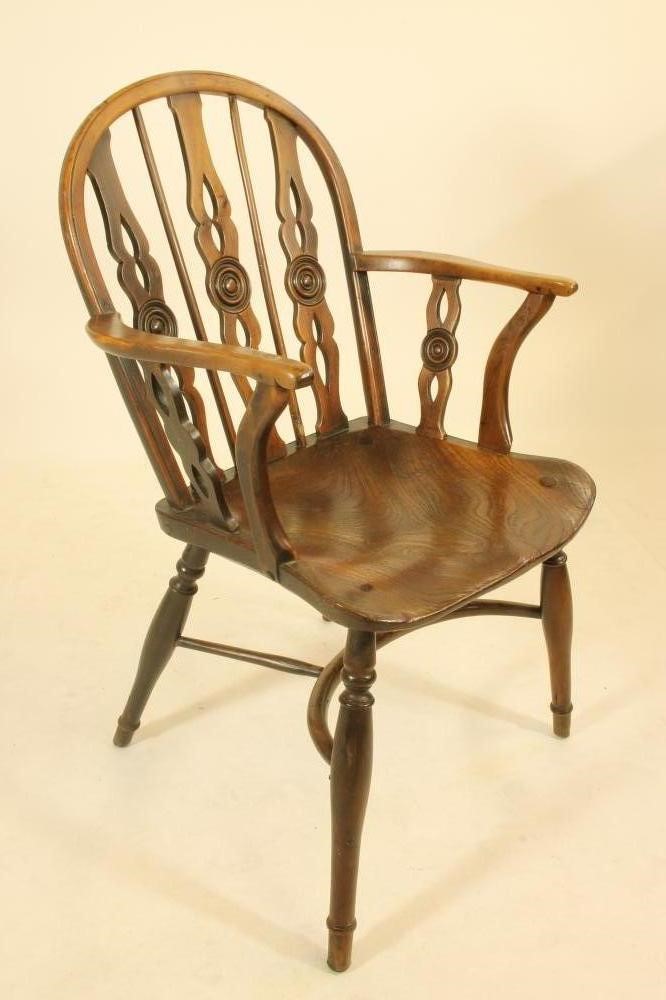 A SET OF FOUR YEW WINDSOR ARMCHAIRS Image