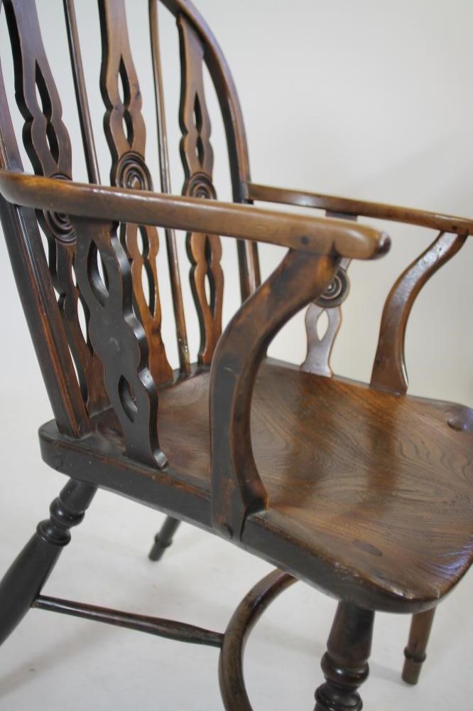 A SET OF FOUR YEW WINDSOR ARMCHAIRS Image