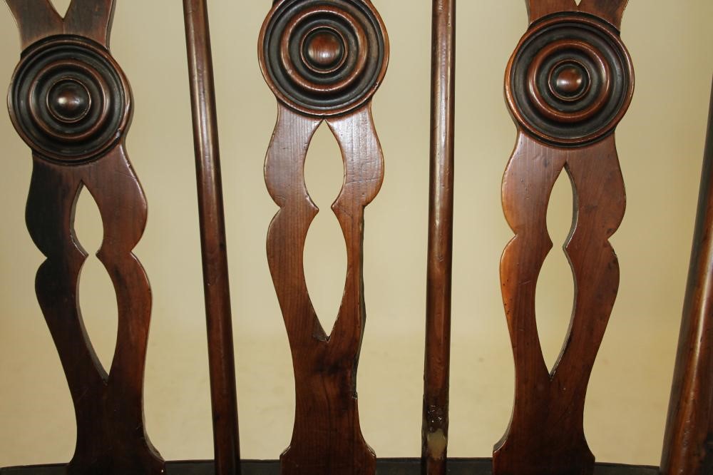 A SET OF FOUR YEW WINDSOR ARMCHAIRS Image