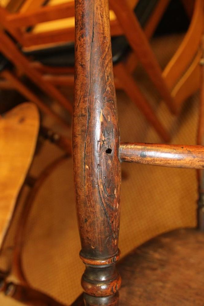 A SET OF FOUR YEW WINDSOR ARMCHAIRS Image