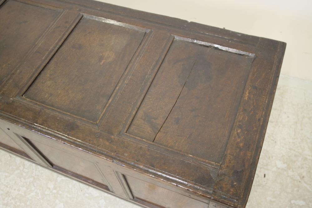 AN OAK PANELLED COFFER Image