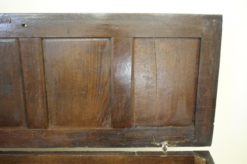 AN OAK PANELLED COFFER Image