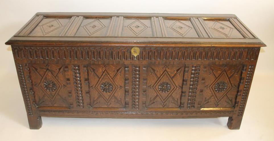 AN OAK PANELLED COFFER Image