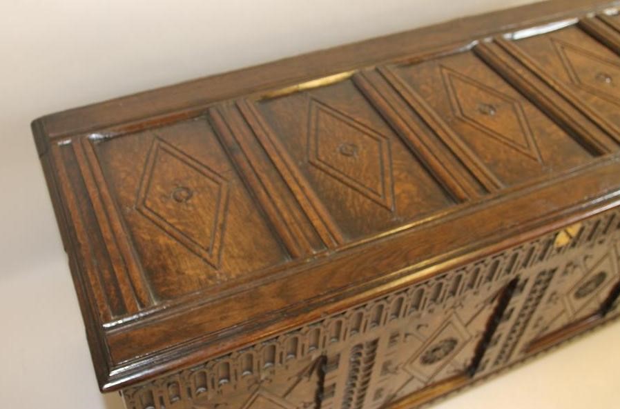 AN OAK PANELLED COFFER Image