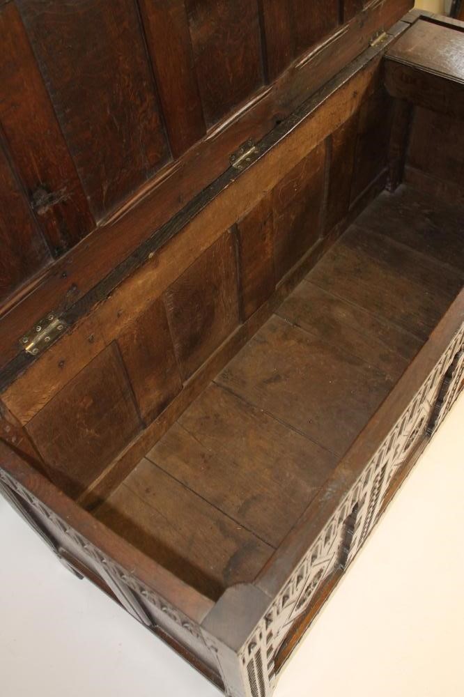 AN OAK PANELLED COFFER Image