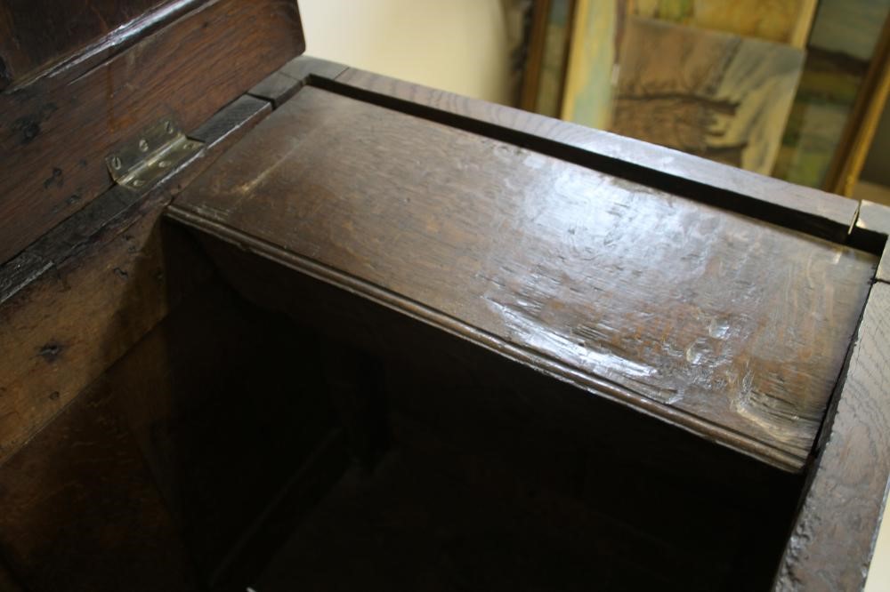 AN OAK PANELLED COFFER Image