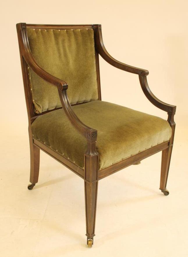 A REGENCY MAHOGANY ELBOW CHAIR upholstered in green velvet Image