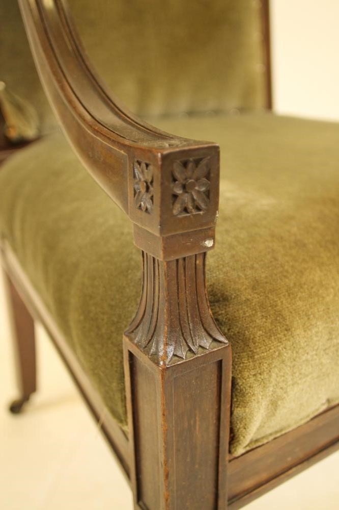 A REGENCY MAHOGANY ELBOW CHAIR upholstered in green velvet Image