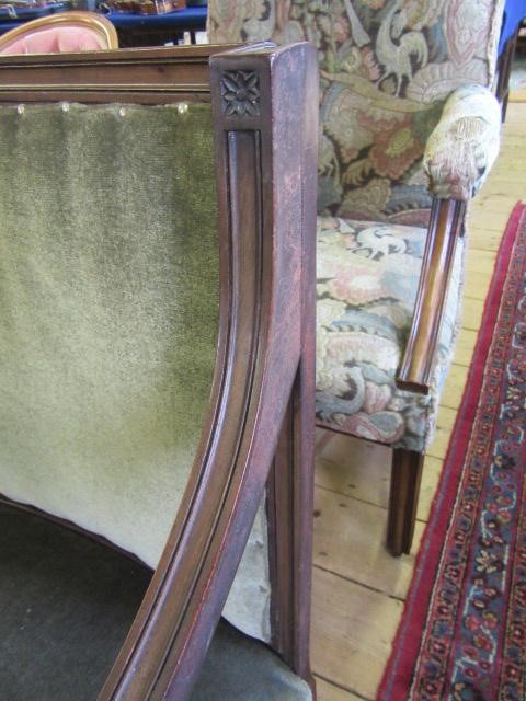A REGENCY MAHOGANY ELBOW CHAIR upholstered in green velvet Image