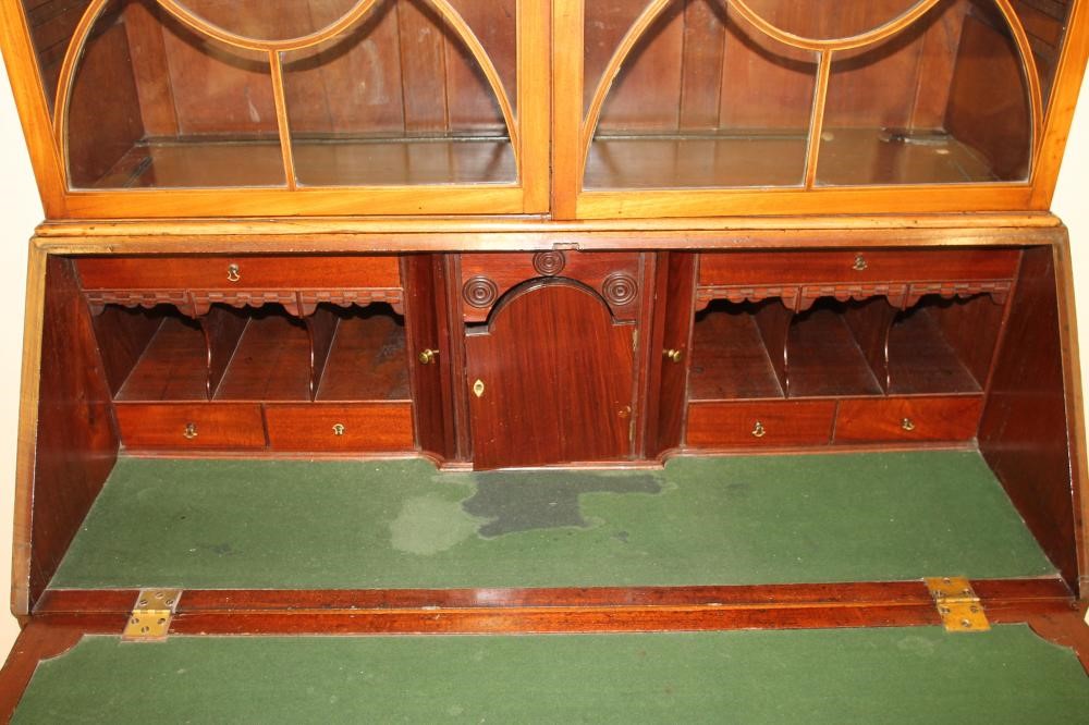 A GEORGE III MAHOGANY BUREAU BOOKCASE Image