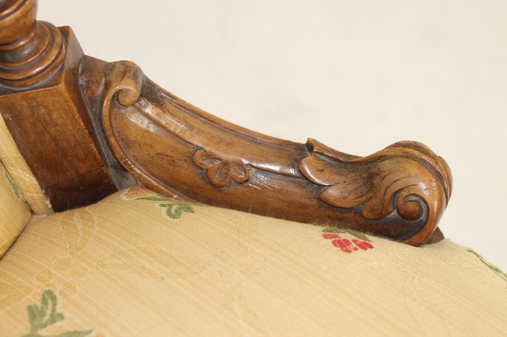 A PAIR OF VICTORIAN WALNUT LOW SALON CHAIRS Image