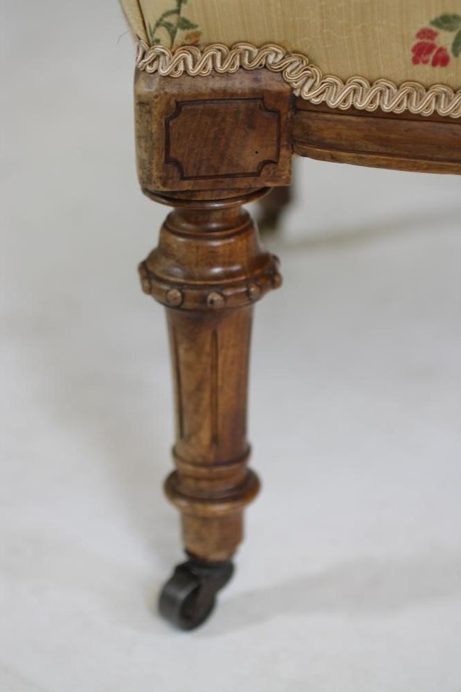 A PAIR OF VICTORIAN WALNUT LOW SALON CHAIRS Image