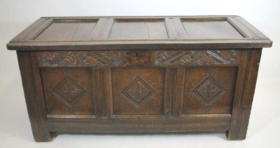 AN OAK PANELLED COFFER Image