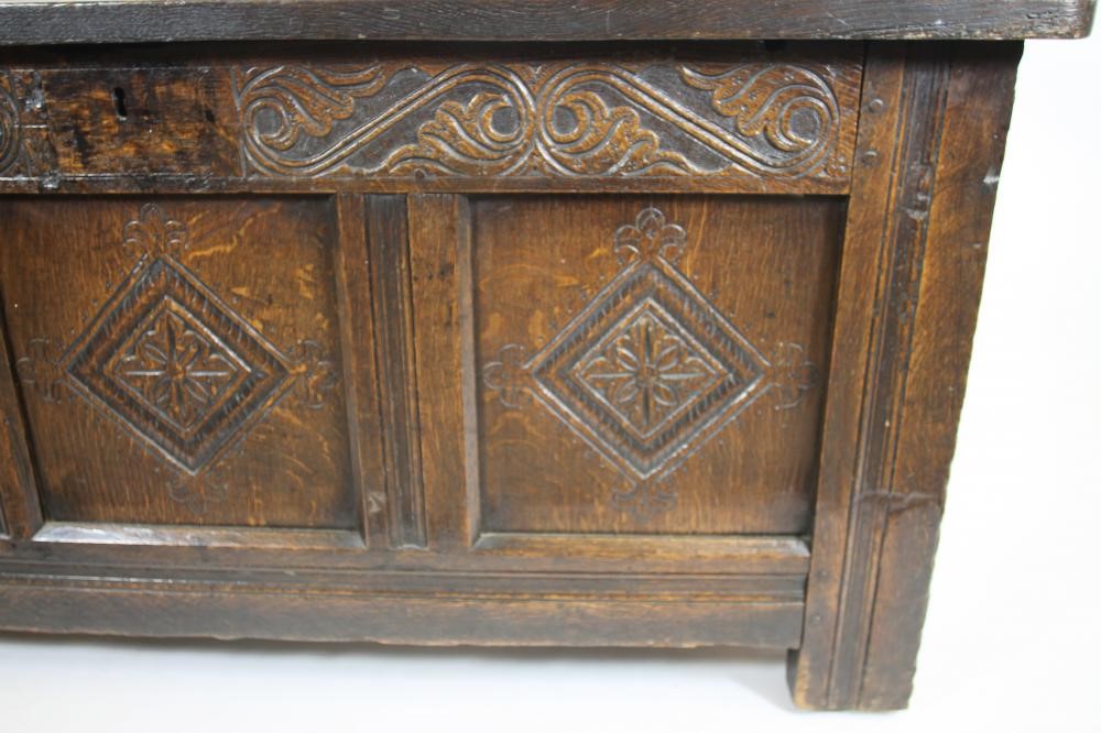 AN OAK PANELLED COFFER Image