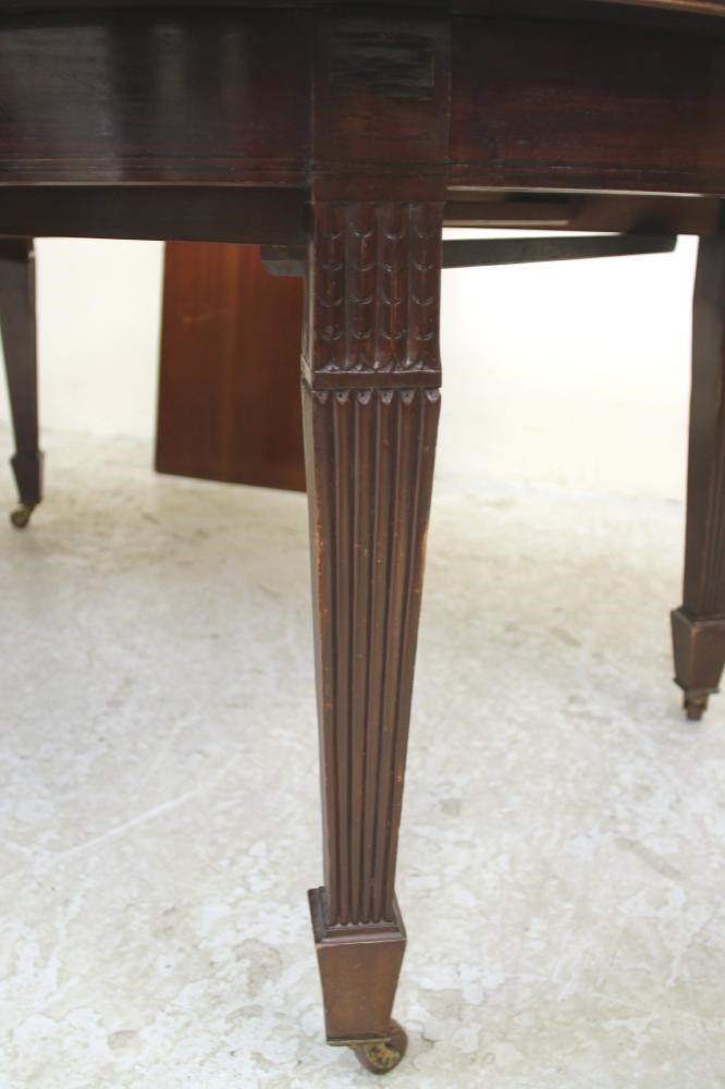 A GEORGIAN REVIVAL MAHOGANY EXTENDING DINING TABLE Image