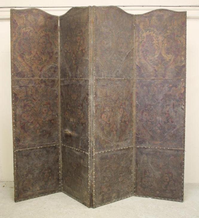 A FOUR FOLD EMBOSSED LEATHER ROOM SCREEN Image