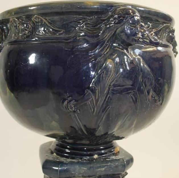 A CONTINENTAL HEAVY EARTHENWARE JARDINIERE AND STAND Image