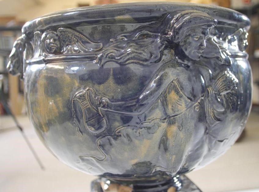 A CONTINENTAL HEAVY EARTHENWARE JARDINIERE AND STAND Image