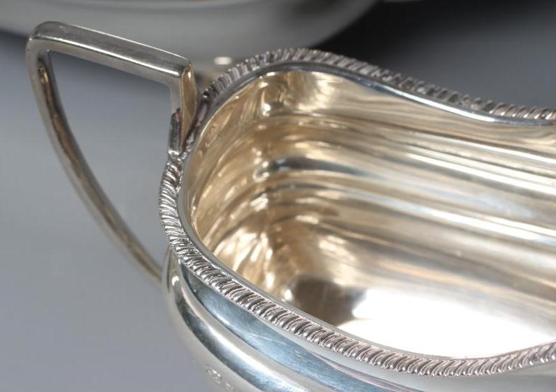 A GEORGE V SILVER THREE PIECE TEA SERVICE by Z Barraclough & Sons Image
