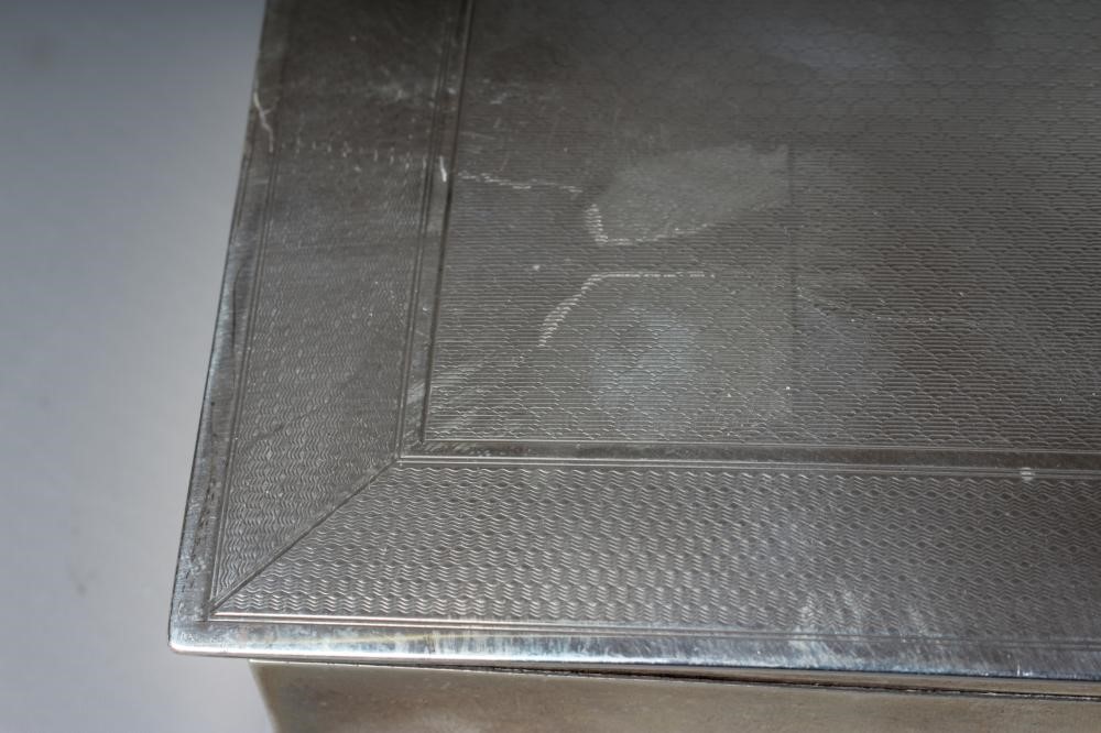 A GEORGE V SILVER OBLONG CIGARETTE BOX by George Unite & Sons Image