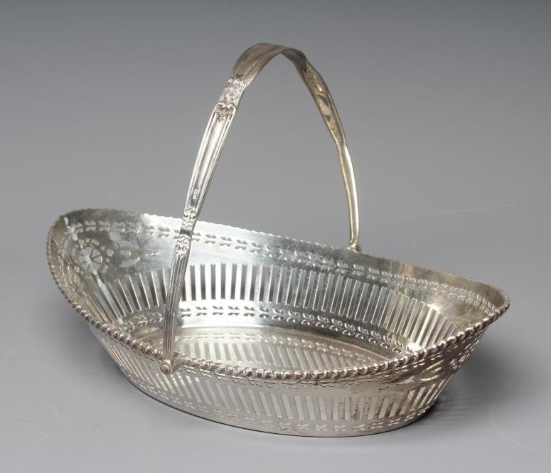 A GEORGE V SILVER BASKET by Barker Bros. Image