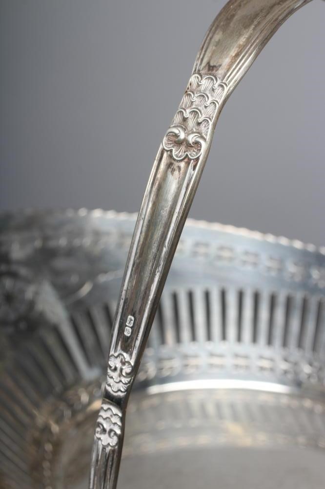 A GEORGE V SILVER BASKET by Barker Bros. Image