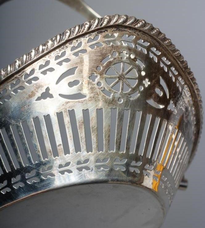 A GEORGE V SILVER BASKET by Barker Bros. Image