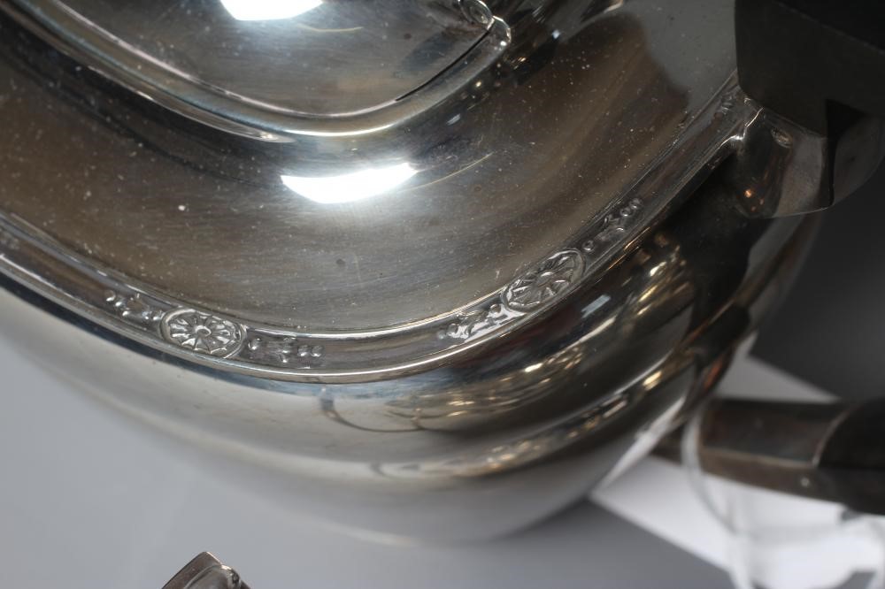 A GEORGE V SILVER FOUR PIECE TEA AND COFFEE SERVICE by Frank Cobb & Co. Ltd. Image