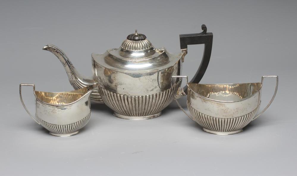 A GEORGE V SILVER THREE PIECE TEA SERVICE by Robert Pringle & Sons Image