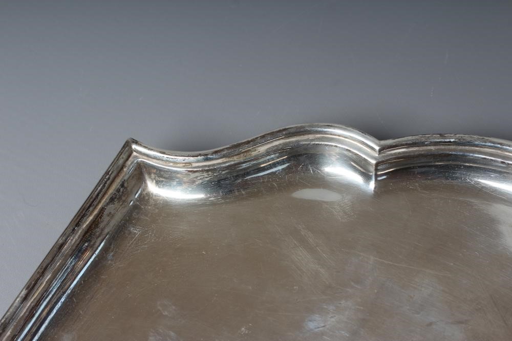 A GEORGE V SILVER SALVER by Josiah Williams & Co., London 1926, of shaped square form with lobed Image