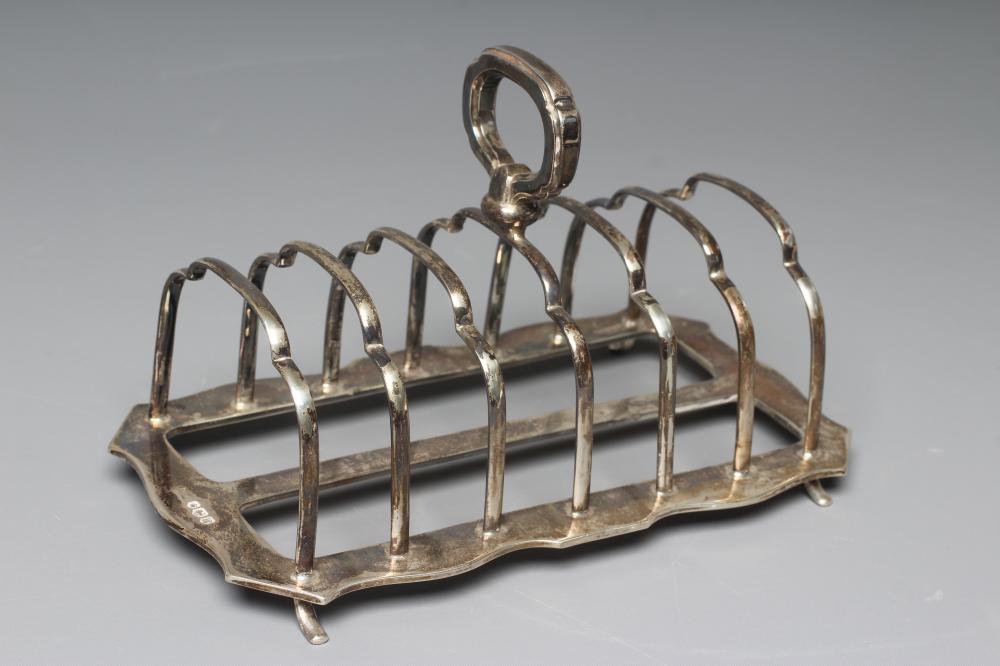 AN ELIZABETH II SILVER SEVEN BAR TOASTRACK by Walker & Hall Image